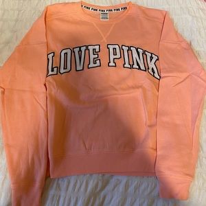 PINK brand sweaters, hoodies, and shirts.